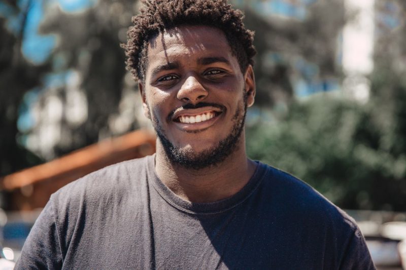 A man smiling because he listened to our summer driving tips