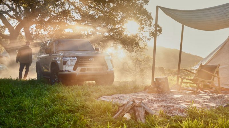 Lexus parked beside a tent