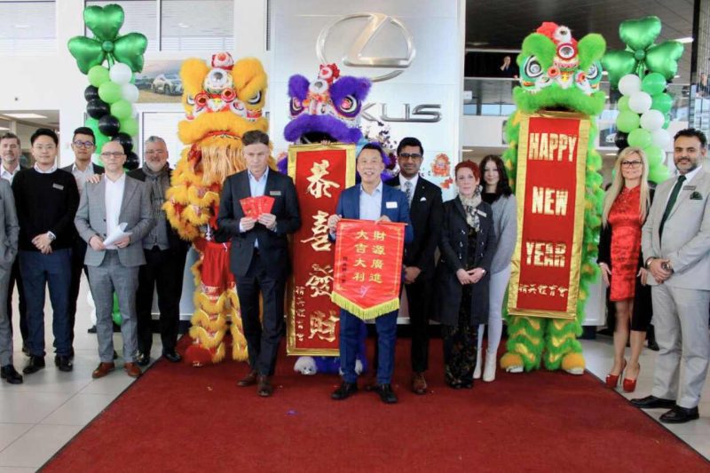 The staff and team at Lexus South Pointe pose with Chinese Lion Dancers.