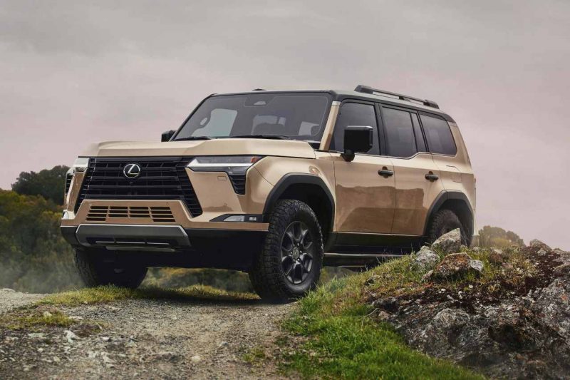 A Lexus GX SUV stands on top of a rocky hill.