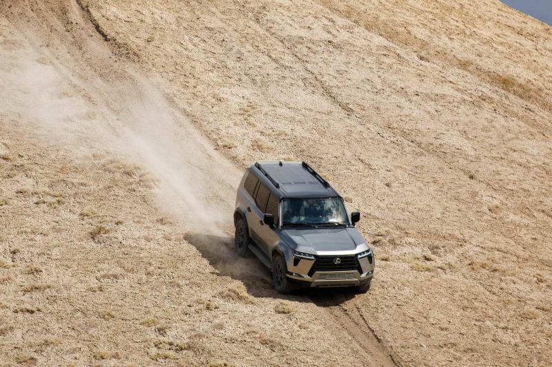 A Lexus GX SUV off-roads in the desert.
