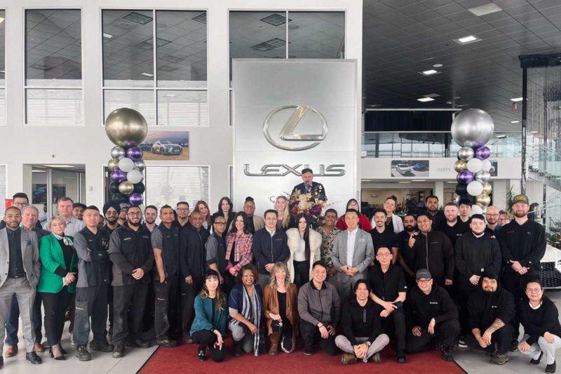 The Lexus South Pointe team poses in the dealership lobby.