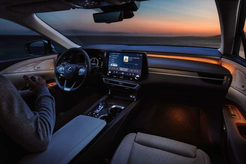 The interior of a Lexus RX vehicle with LED illumination lights on the dash.